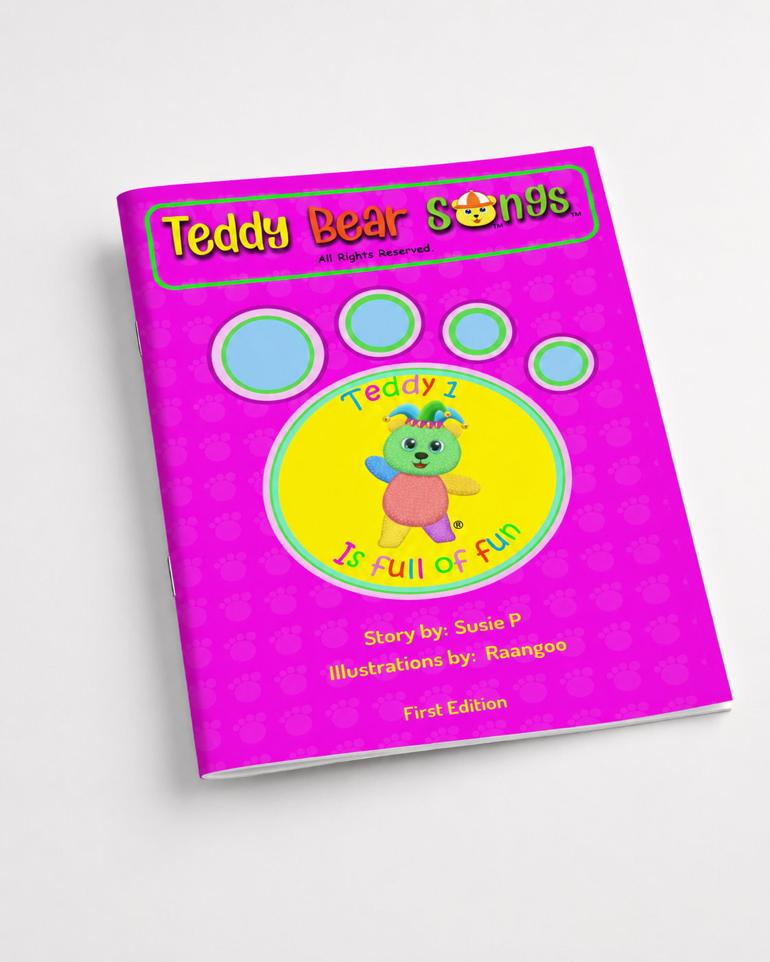 A children's song book titled 'Teddy Bear Songs' shown at an angle on a light gray background. The cover is bright pink with a large yellow circle in the center, blue paw-print outlines, and a cartoon teddy bear wearing a party hat.